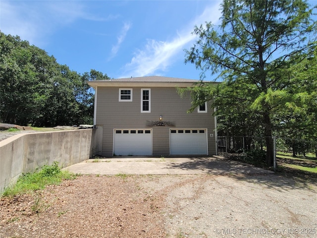 view of side of home featuring a garage