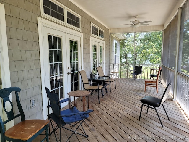 sunroom / solarium with french doors and ceiling fan