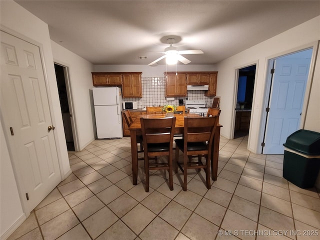 tiled dining room with ceiling fan