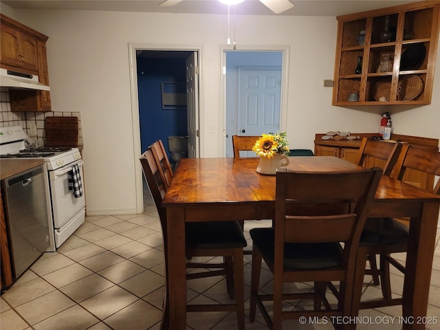 dining area with light tile patterned flooring