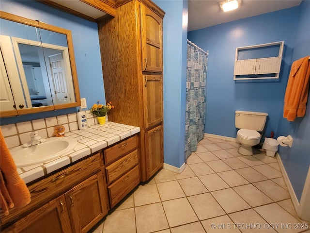 bathroom featuring toilet, vanity, a shower with shower curtain, tile patterned flooring, and backsplash