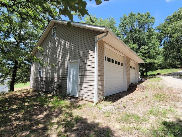 view of property exterior featuring a garage