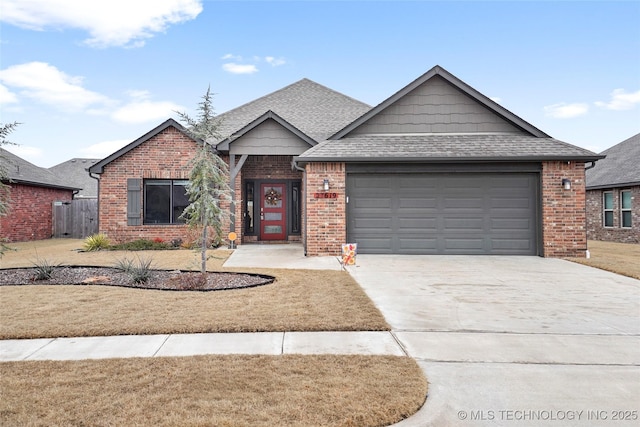 view of front of property featuring a garage and a front yard