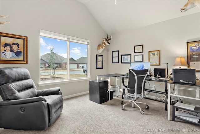 office area with high vaulted ceiling and carpet