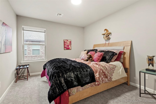 bedroom featuring light carpet