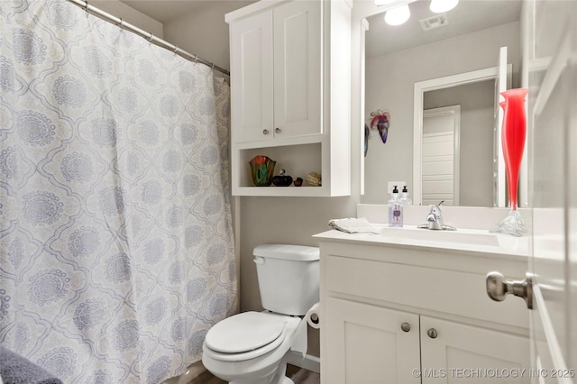 bathroom with vanity and toilet