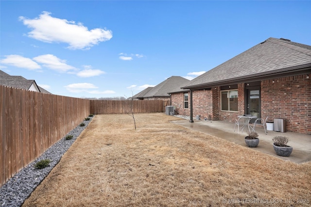 view of yard featuring a patio and cooling unit