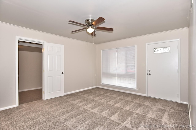 interior space featuring crown molding and ceiling fan