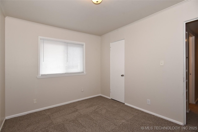 carpeted empty room with ornamental molding