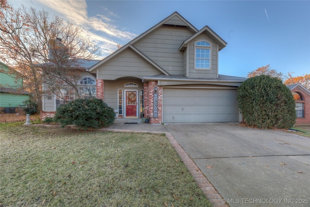 view of front of home featuring a garage and a front yard