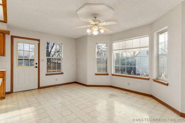 interior space featuring a wealth of natural light and ceiling fan