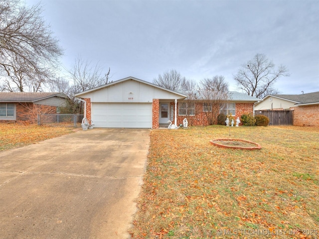 single story home featuring a garage and a front yard