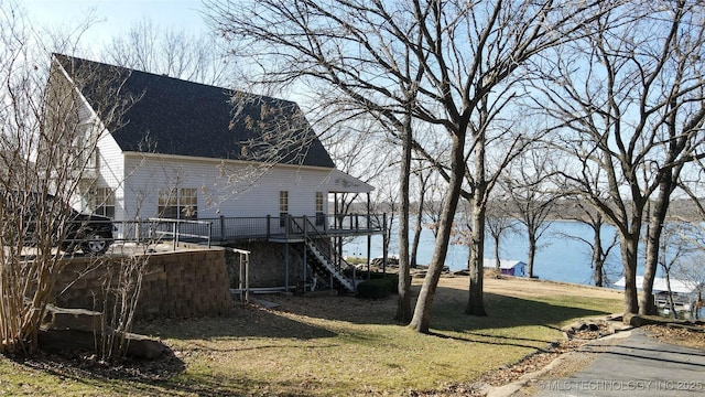 exterior space with a deck with water view