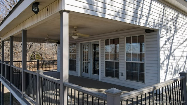 wooden deck featuring ceiling fan