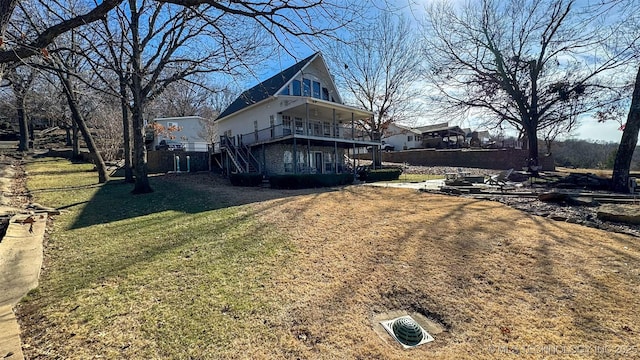 view of side of property with a lawn