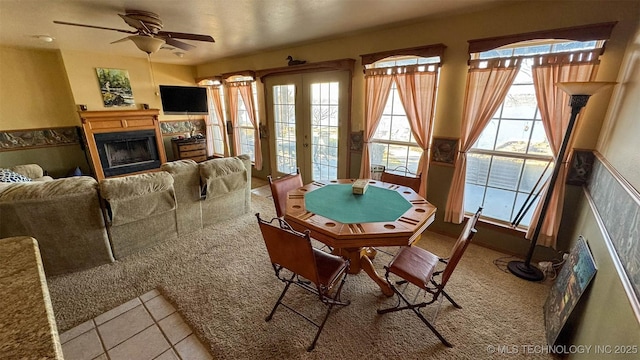 recreation room with ceiling fan and french doors