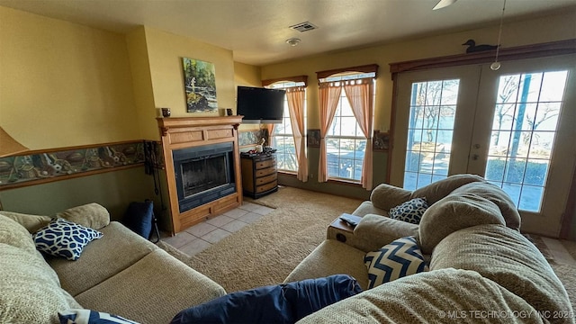 carpeted living room featuring french doors