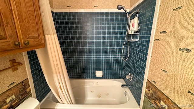 bathroom featuring toilet and shower / bathtub combination with curtain