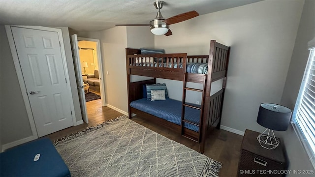 bedroom with dark hardwood / wood-style floors