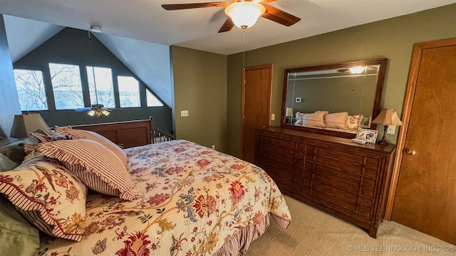 carpeted bedroom featuring vaulted ceiling and ceiling fan