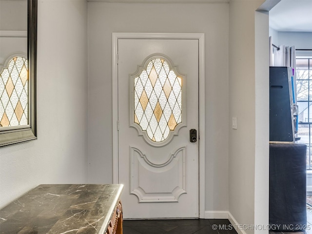 foyer entrance with baseboards