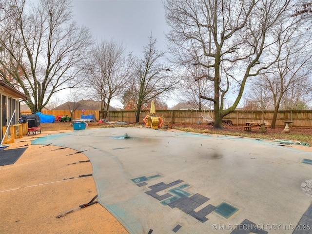 view of pool featuring a fenced backyard and a patio