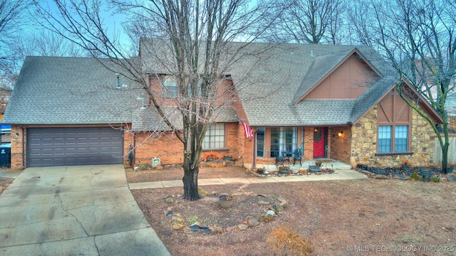 view of front of property with a garage and covered porch