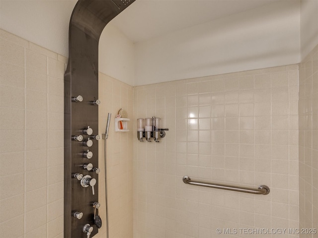 bathroom with a tile shower