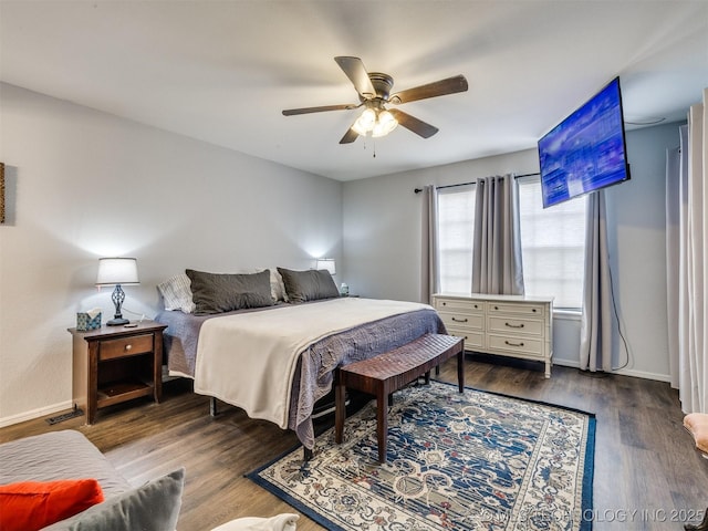 bedroom with a ceiling fan, dark wood-style flooring, visible vents, and baseboards