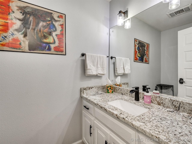 bathroom featuring vanity and visible vents