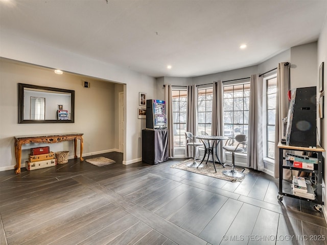 miscellaneous room featuring dark wood-type flooring