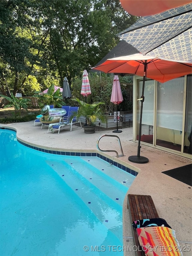 outdoor pool with a patio