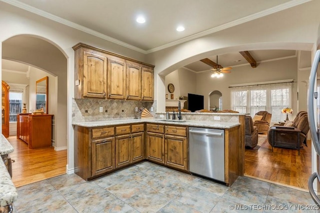 kitchen featuring sink, stainless steel dishwasher, backsplash, and light hardwood / wood-style floors