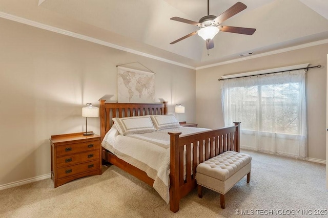 carpeted bedroom featuring a raised ceiling, ornamental molding, and ceiling fan