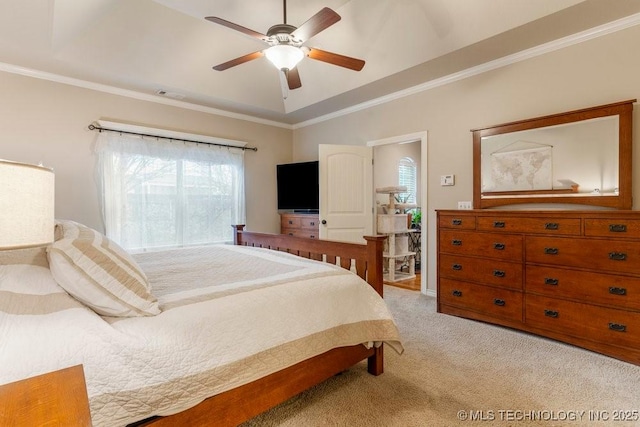 carpeted bedroom featuring ornamental molding and ceiling fan