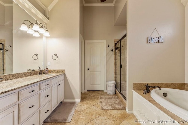 bathroom featuring independent shower and bath, ornamental molding, and vanity