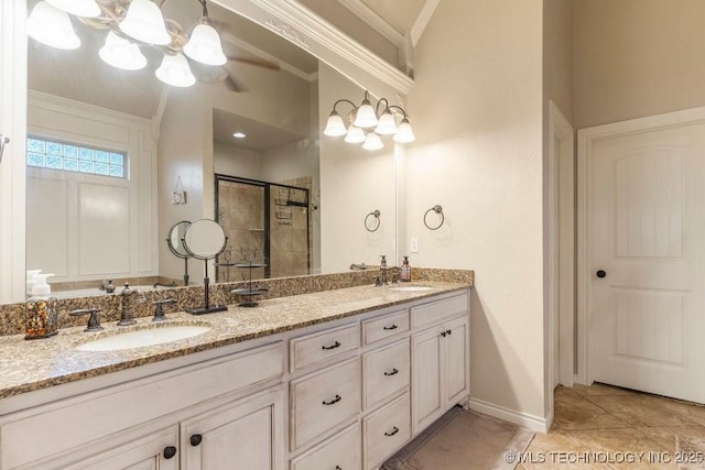 bathroom featuring vanity, tile patterned flooring, a shower with shower door, and ornamental molding