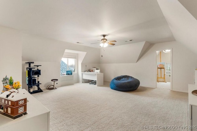 interior space with lofted ceiling, light colored carpet, and ceiling fan