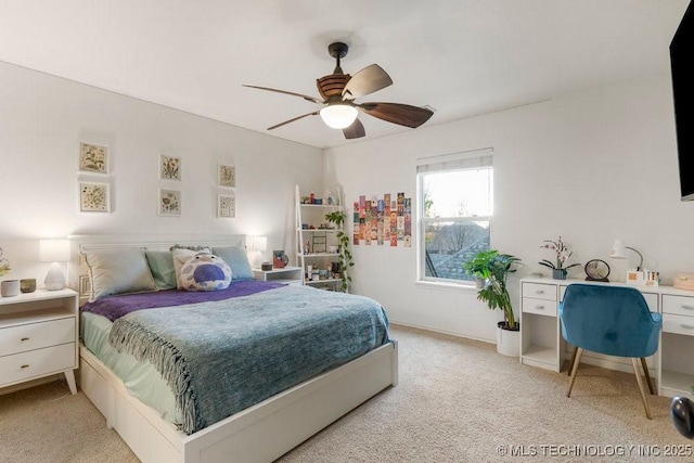 bedroom featuring light colored carpet and ceiling fan