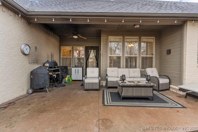 view of patio with ceiling fan and an outdoor living space