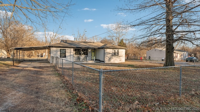 rear view of property featuring a carport