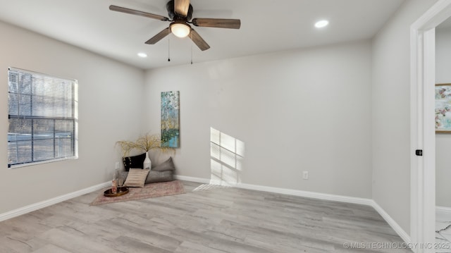 unfurnished room featuring ceiling fan and light hardwood / wood-style flooring