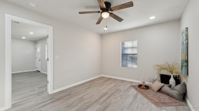 spare room with ceiling fan and light hardwood / wood-style flooring