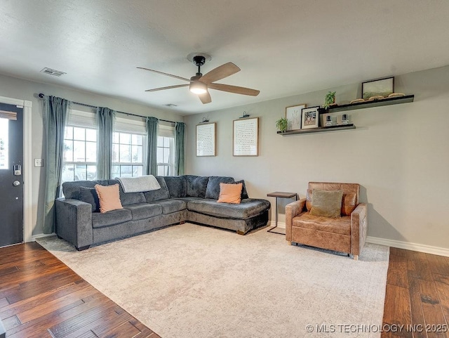 living room with hardwood / wood-style flooring and ceiling fan