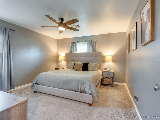 bedroom featuring ceiling fan and carpet