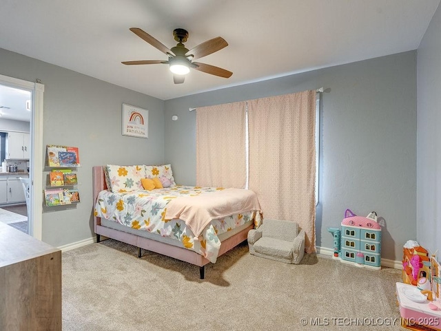 bedroom with ceiling fan and carpet flooring