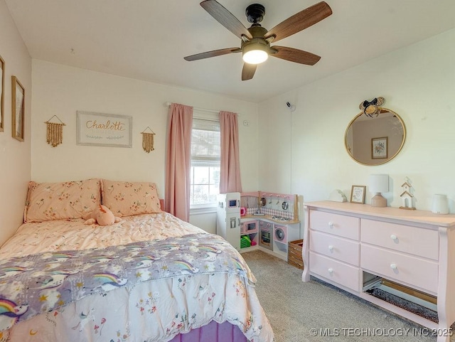 carpeted bedroom featuring ceiling fan