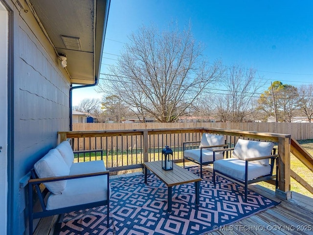 wooden deck with outdoor lounge area