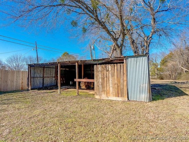 view of outbuilding with a yard