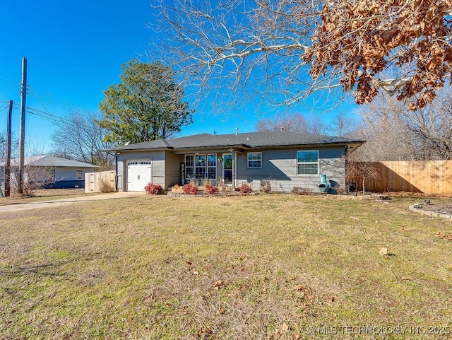 ranch-style house featuring a garage and a front lawn